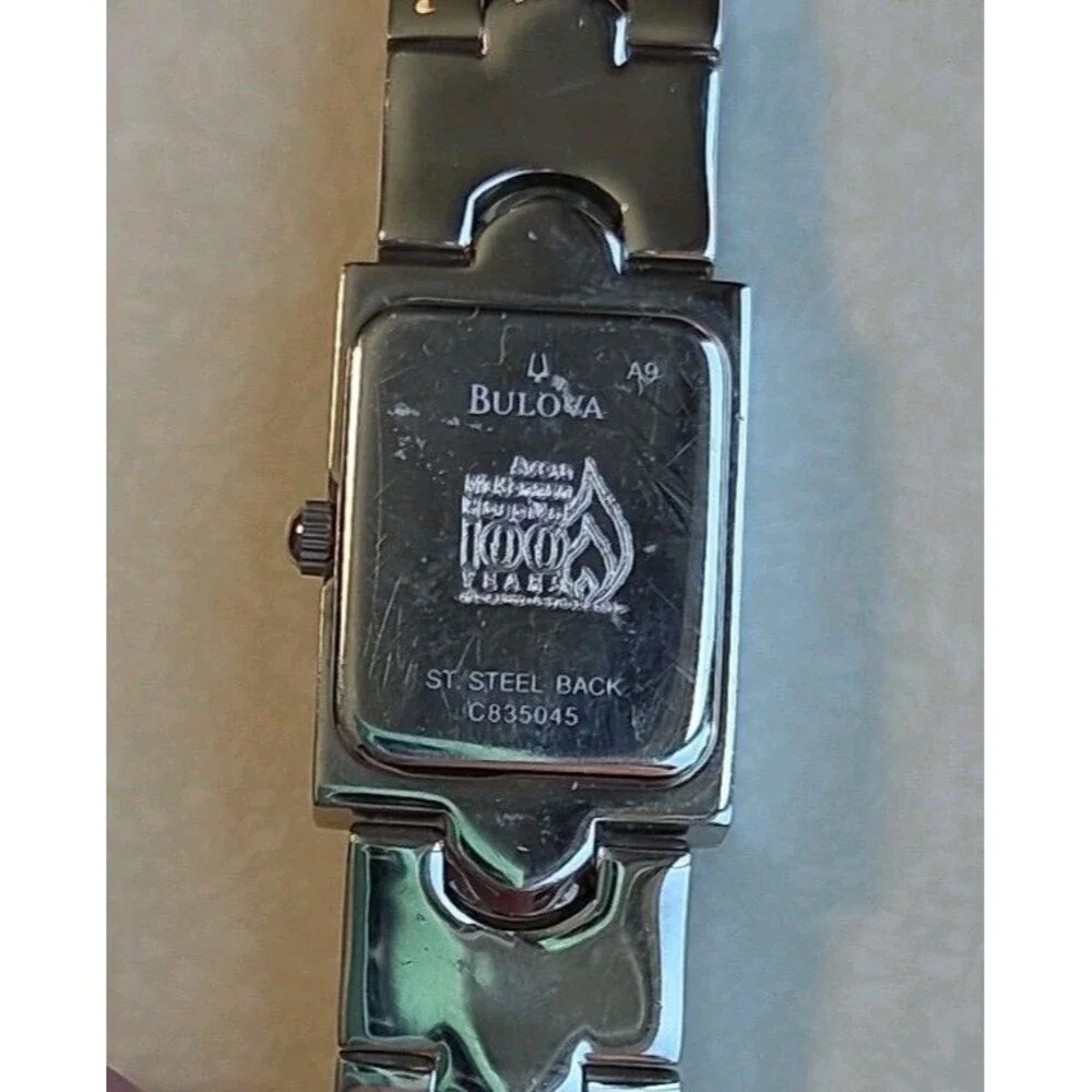 Caravelle by Bulova Silver Rectangle Analog Dress Wristwatch Metal Bracelet